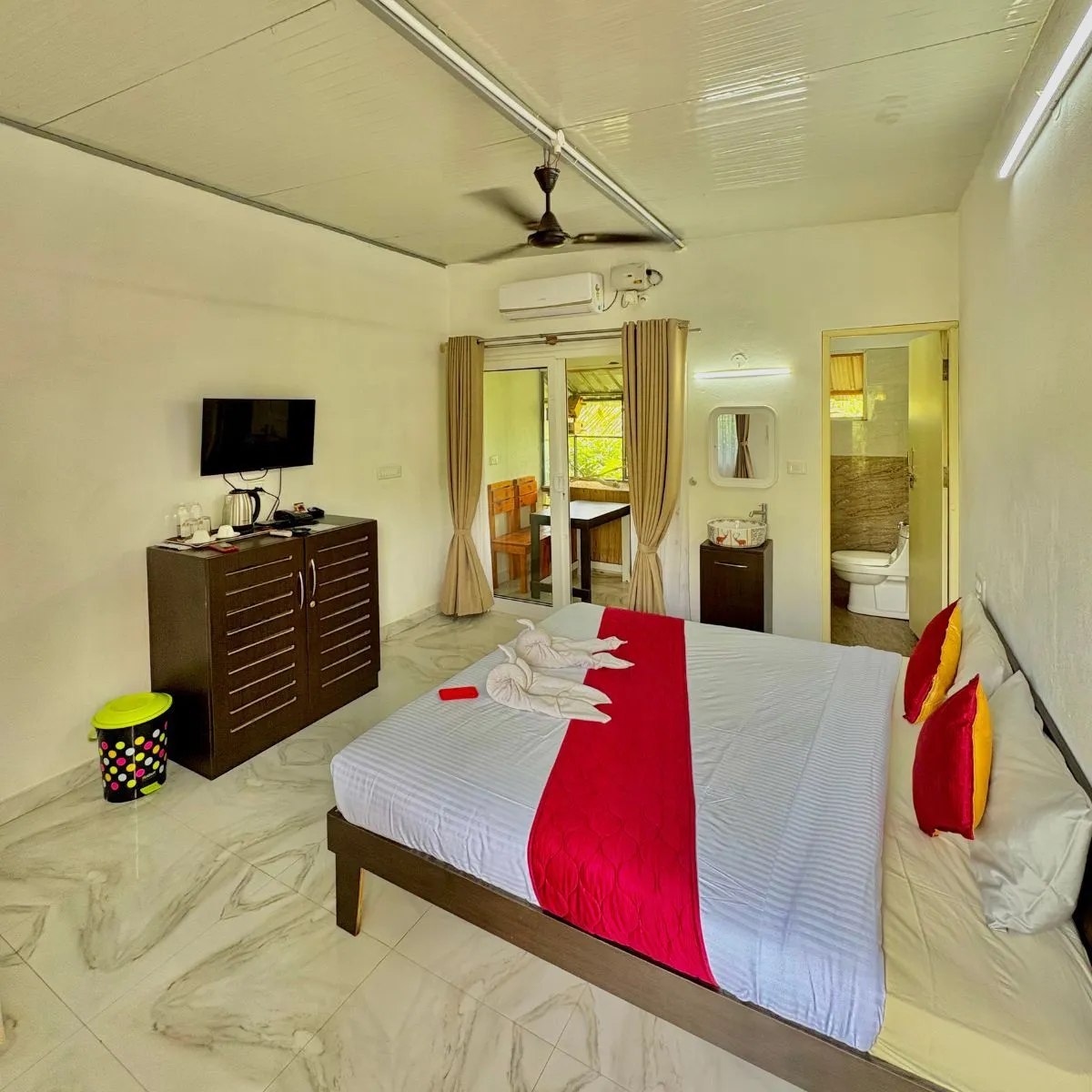 Bird Lounge room with double bed and ceiling fan