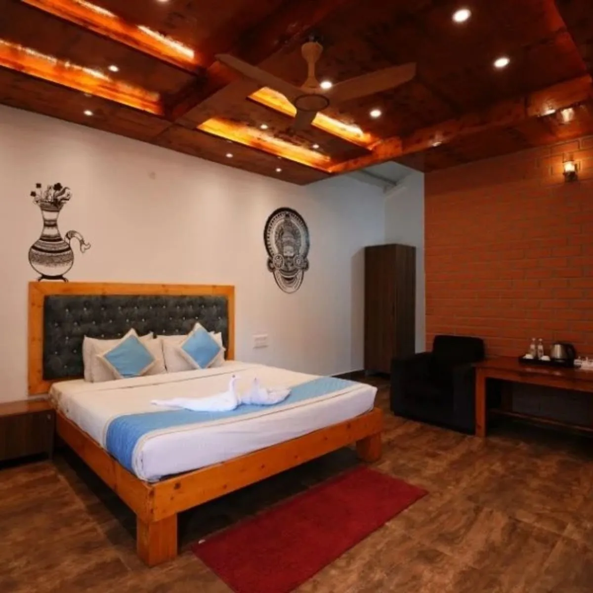 Cob house interior with double bed, seating and rug